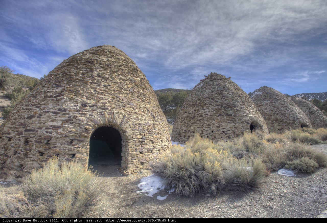 Three Stone Buildings in Snowy Desert