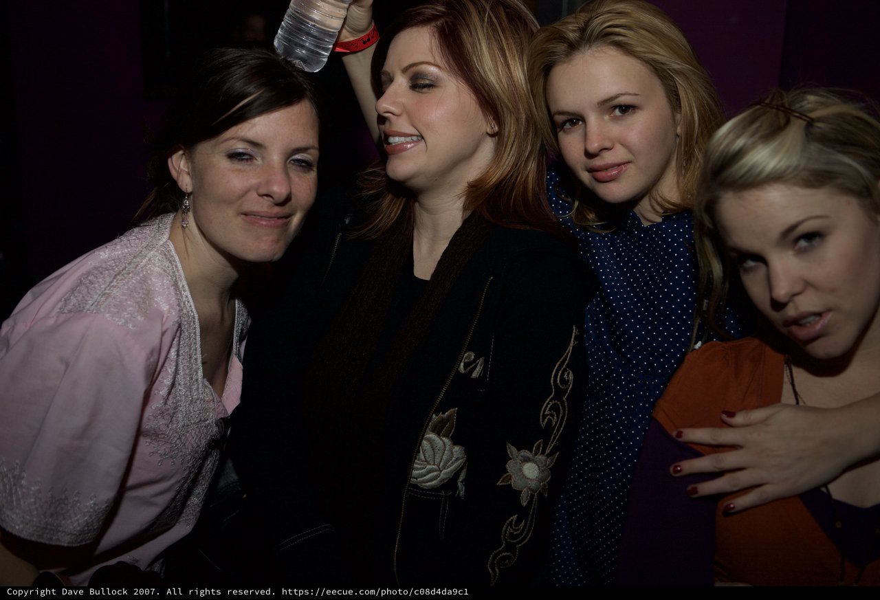 Four Friends Celebrating at a Nightclub Event