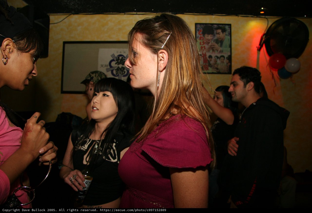 Friends Mingling at a Japanese-Themed Night Club