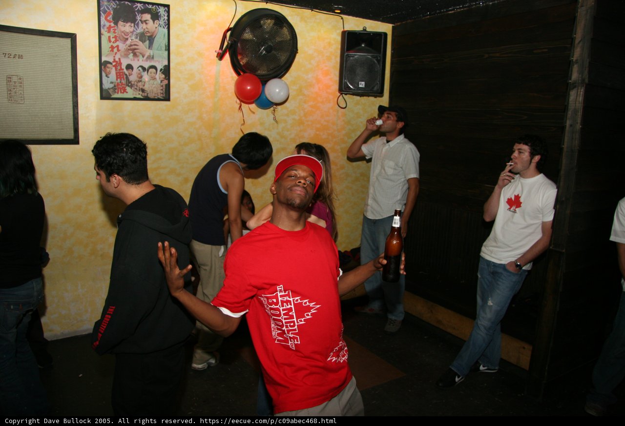 Man in Red T-Shirt and Baseball Cap