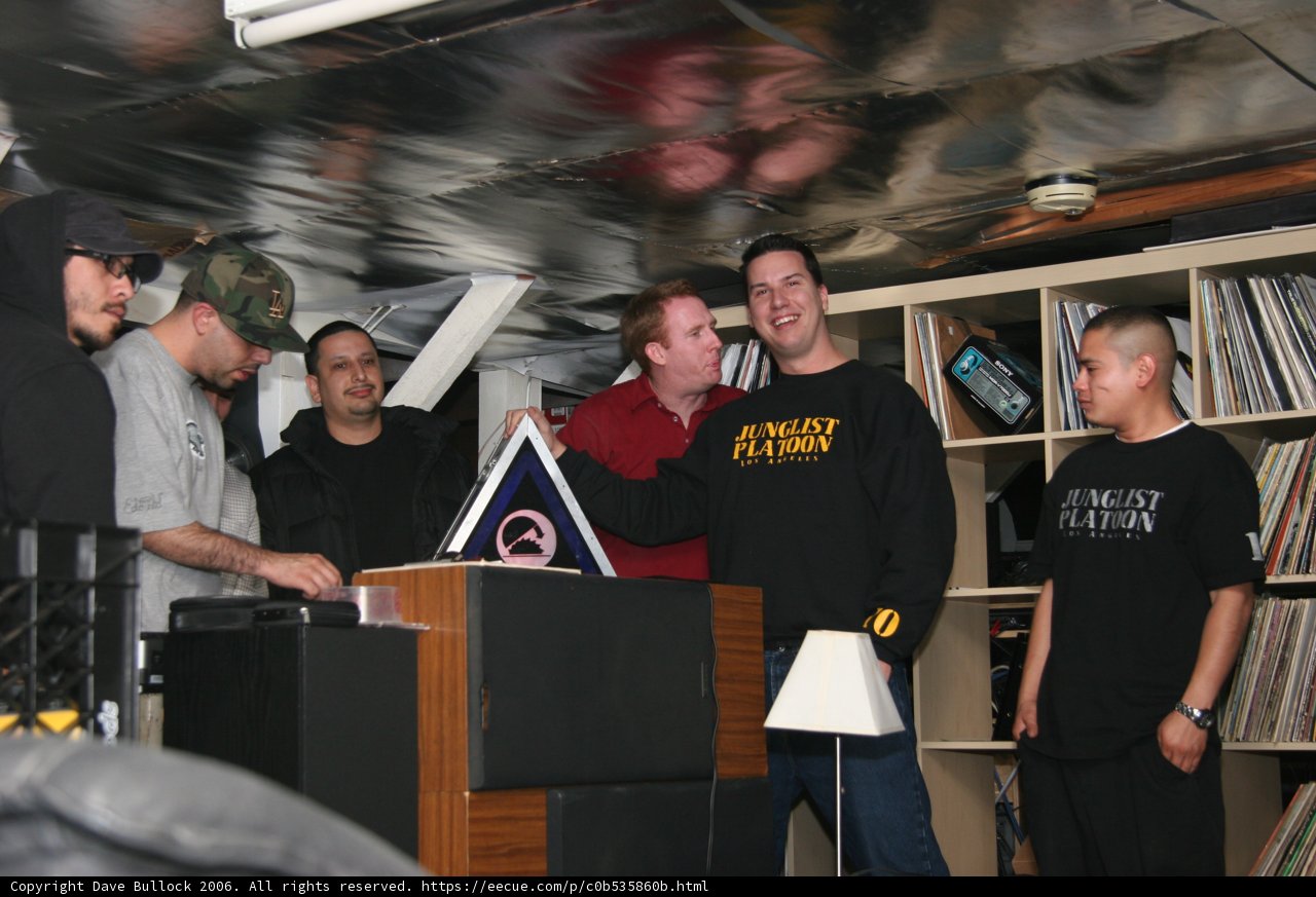 Group of Males Gathered Around a Table