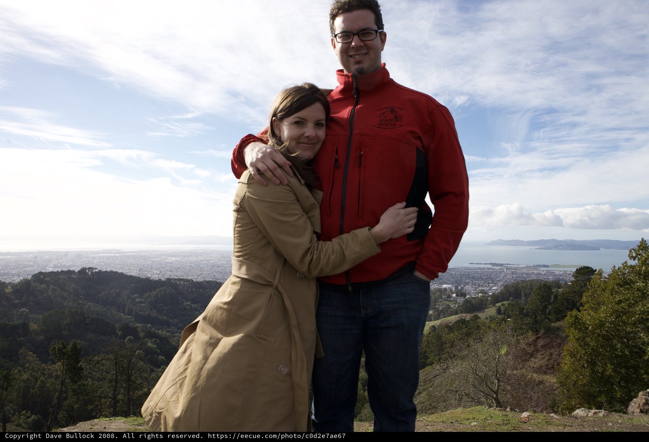 Couple Embracing Atop Berkeley Hills Overlooking San Francisco Bay