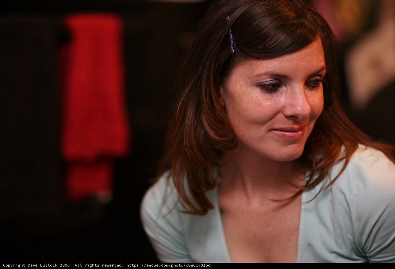 Woman in Contemplative Moment at Evening Event