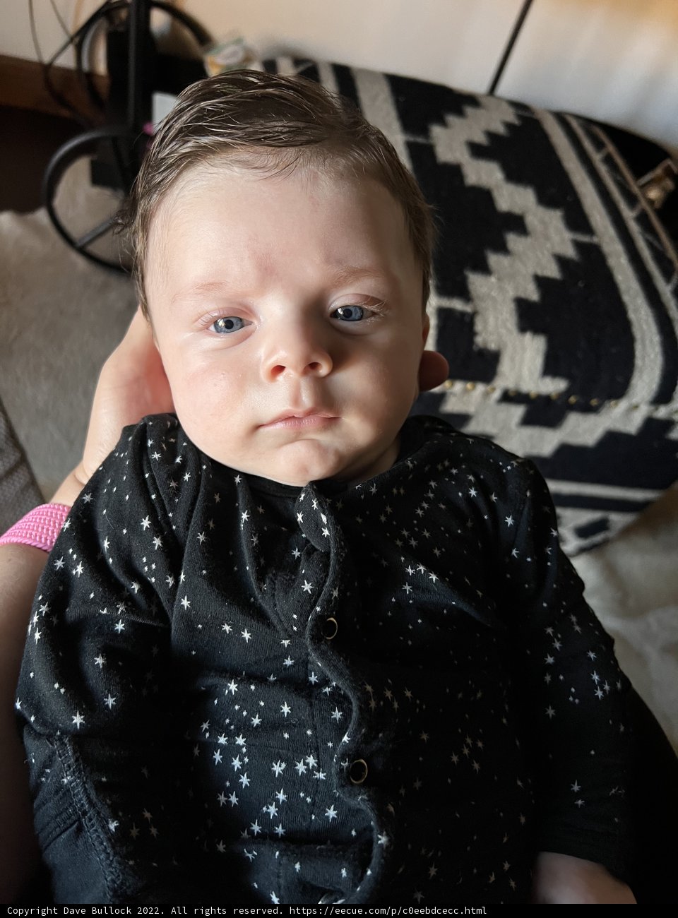 Blue-Eyed Baby in Chair