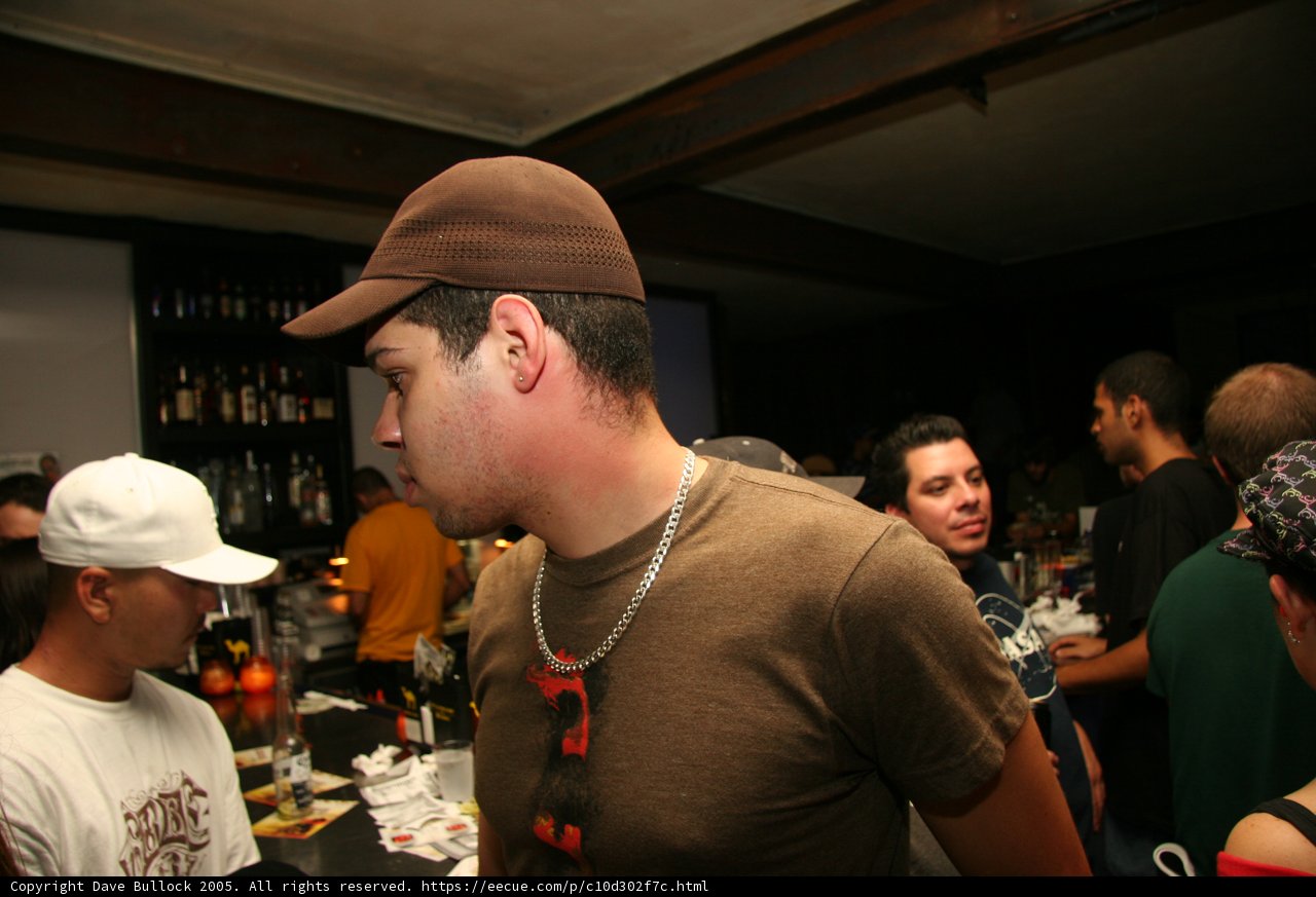 Hat-wearing man at the pub