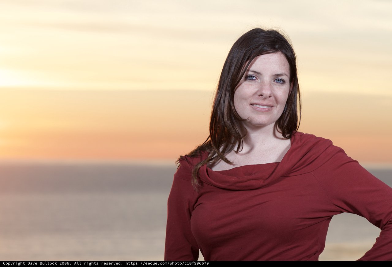 Woman in Red at Golden Hour Seaside