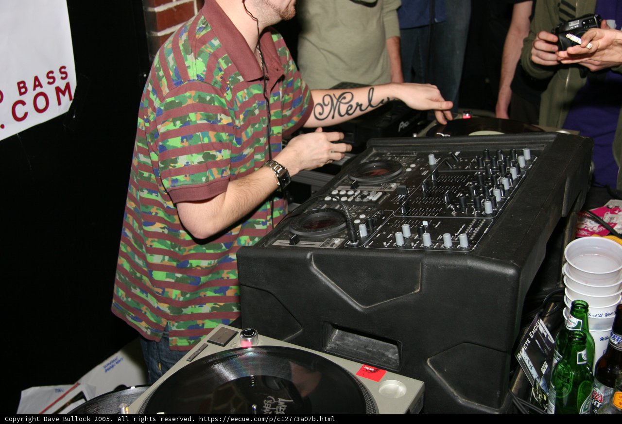 Green-Shirted DJ Spins Beats at Christmas Party