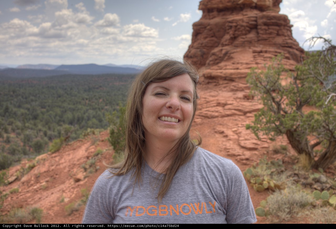 Smiling Woman Among Sedona's Red Rock Formations