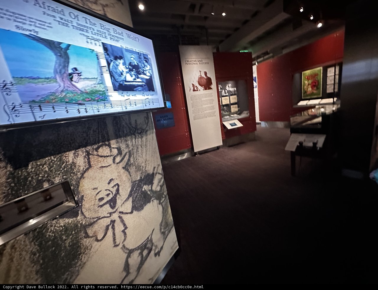 Art Enthusiasts Admiring the Painting Display at Walt Disney Museum