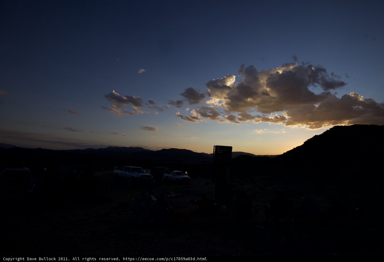 Desert Sunset with Cars and Clouds