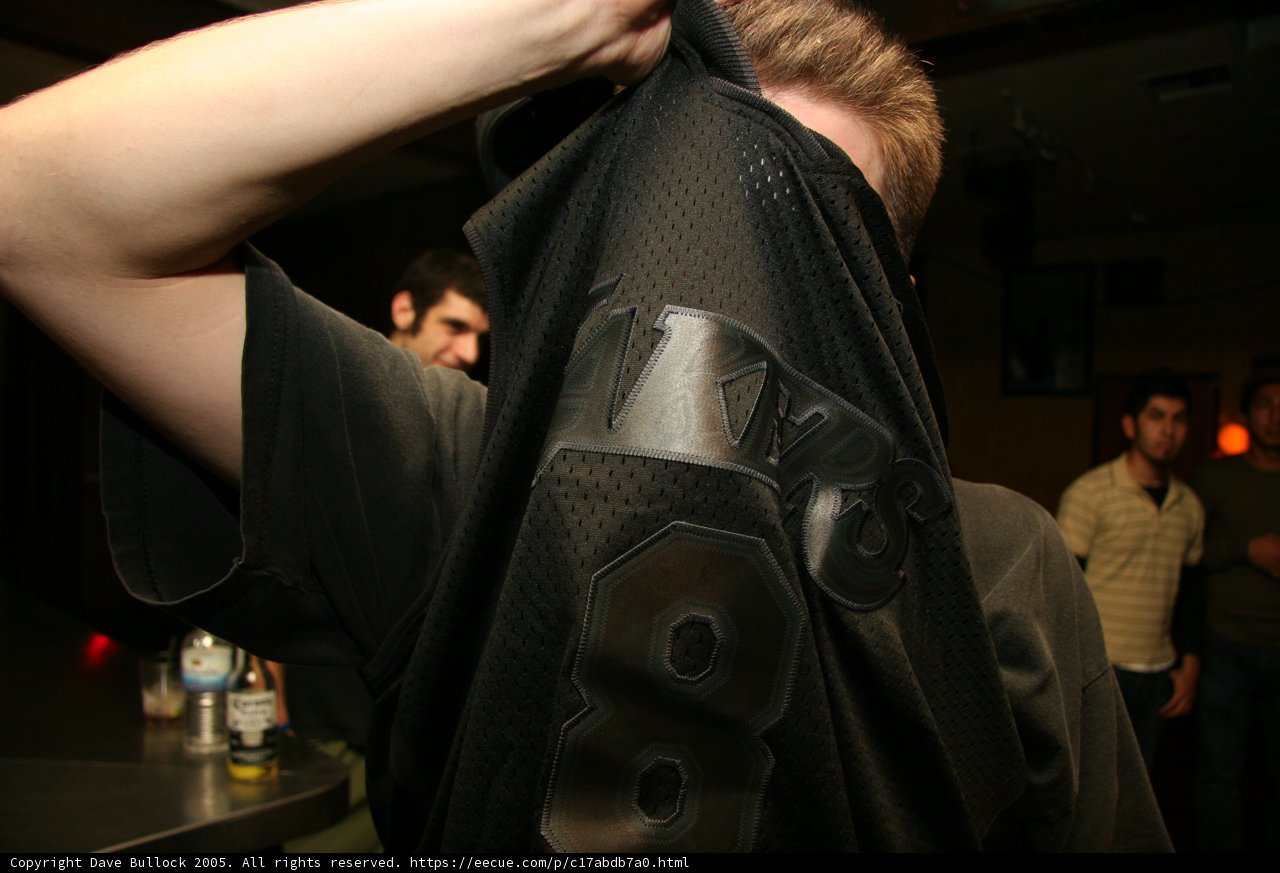 Fashionable Man Holding Black Shirt
