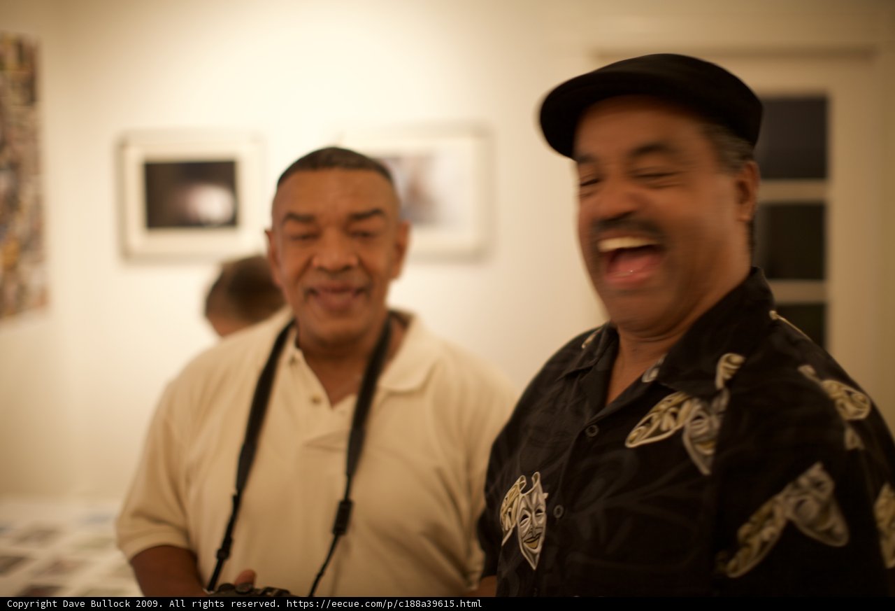 Black Shirted Man with Smile and Cap