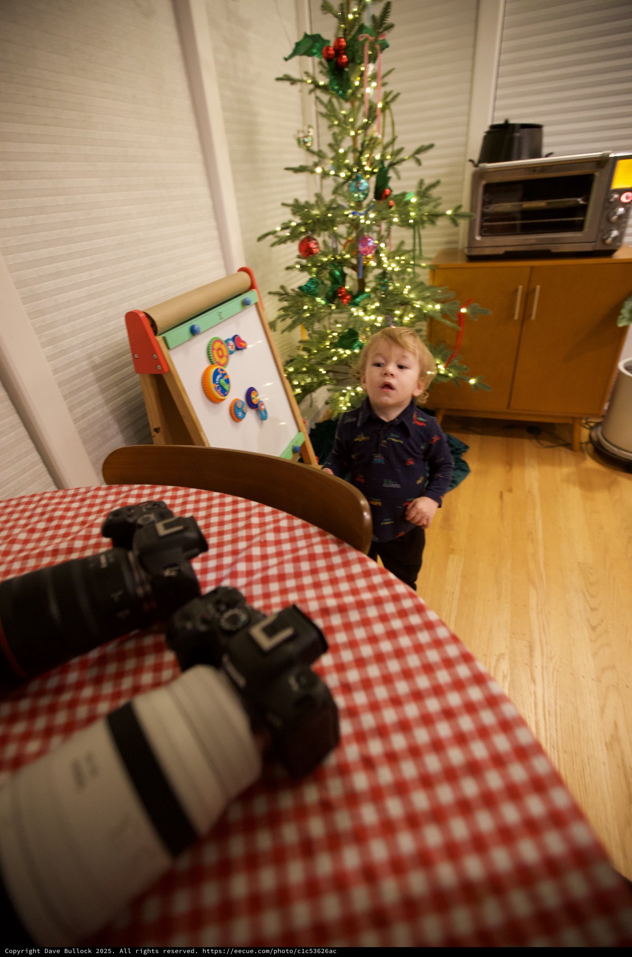Child's Candid Moment During Christmas Morning Photography Setup