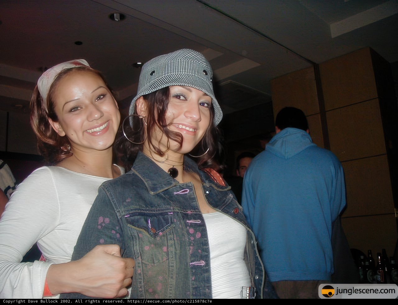 Smiling Women in Hats and Hoodies