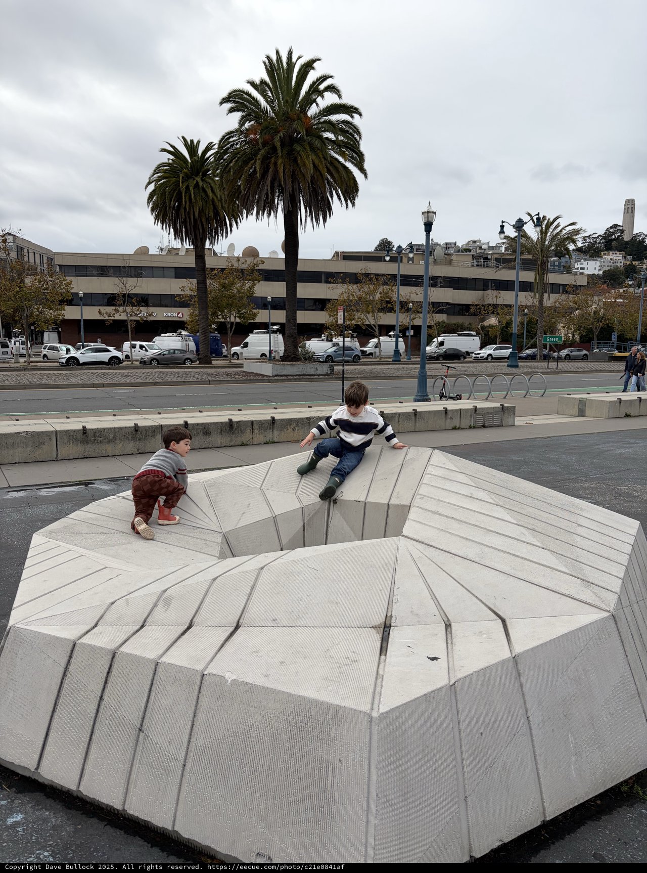 Children Playing on Modern Urban Sculpture Installation