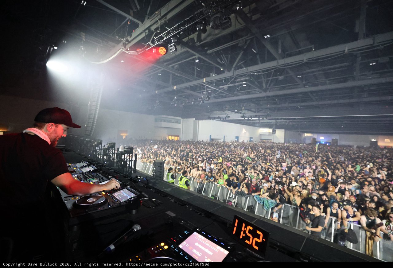 DJ Performs for Massive Indoor Festival Crowd at Midnight