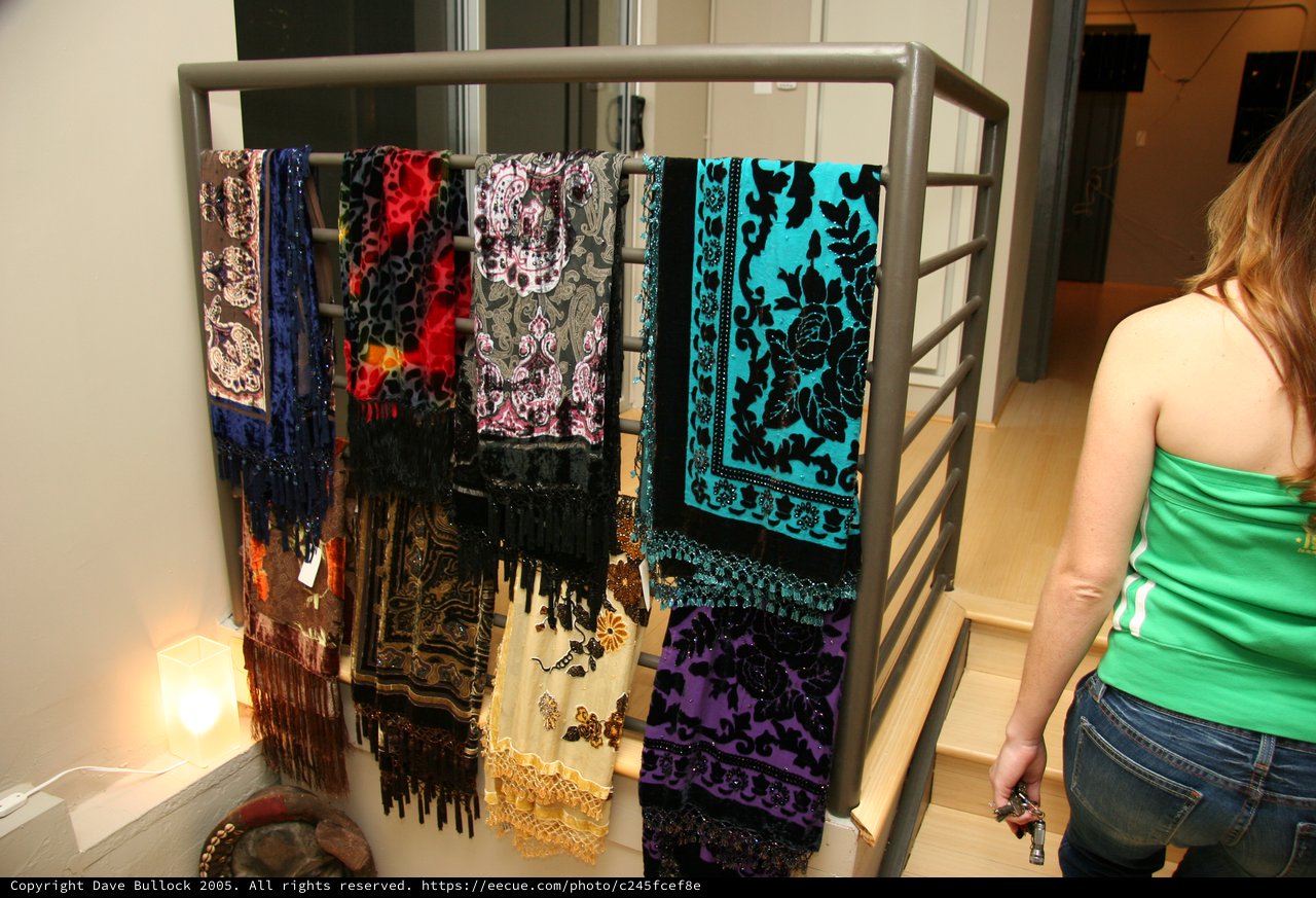 Colorful Scarves Displayed on Metal Stair Railing