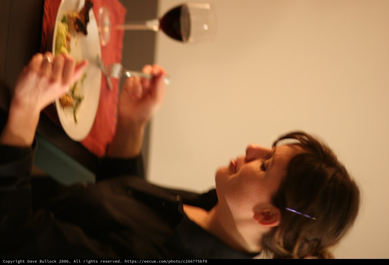 Quiet Dinner: Woman Dining Alone by Candlelight