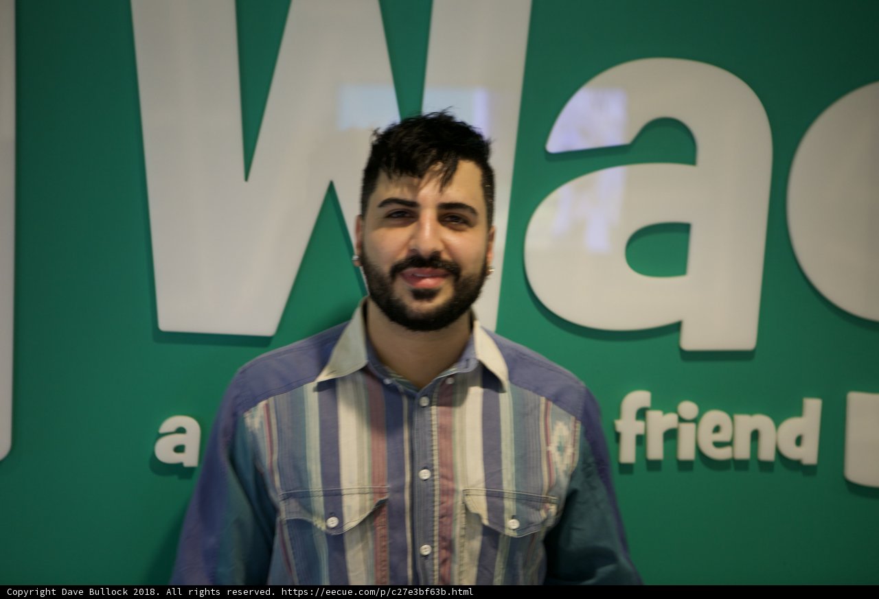 The Happy Man with a Big Smile in Front of WAG Wall