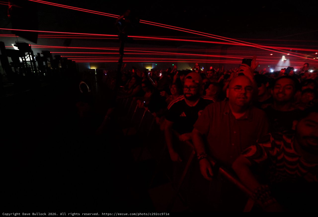 Red Laser Light Show Over Massive Concert Crowd