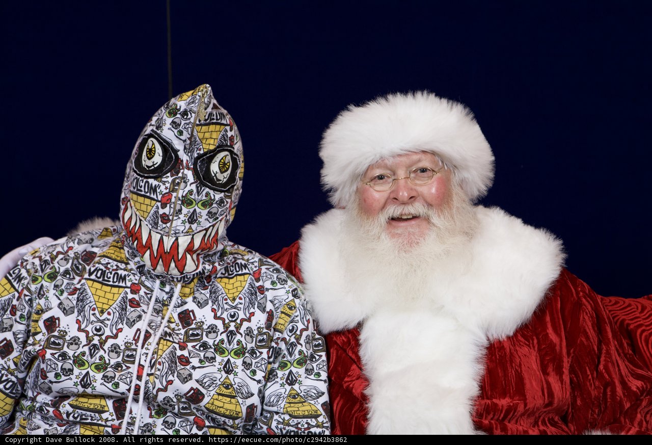 Santa meets his masked match