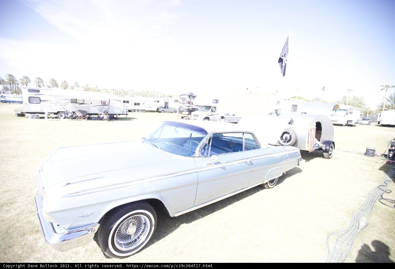 Silver Sedan and Trailer in the Fields