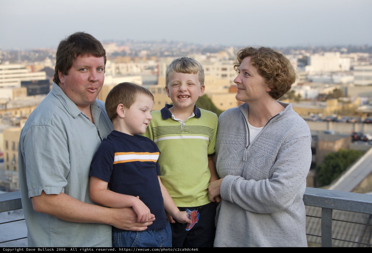 Family Portrait on Urban Rooftop at Dusk