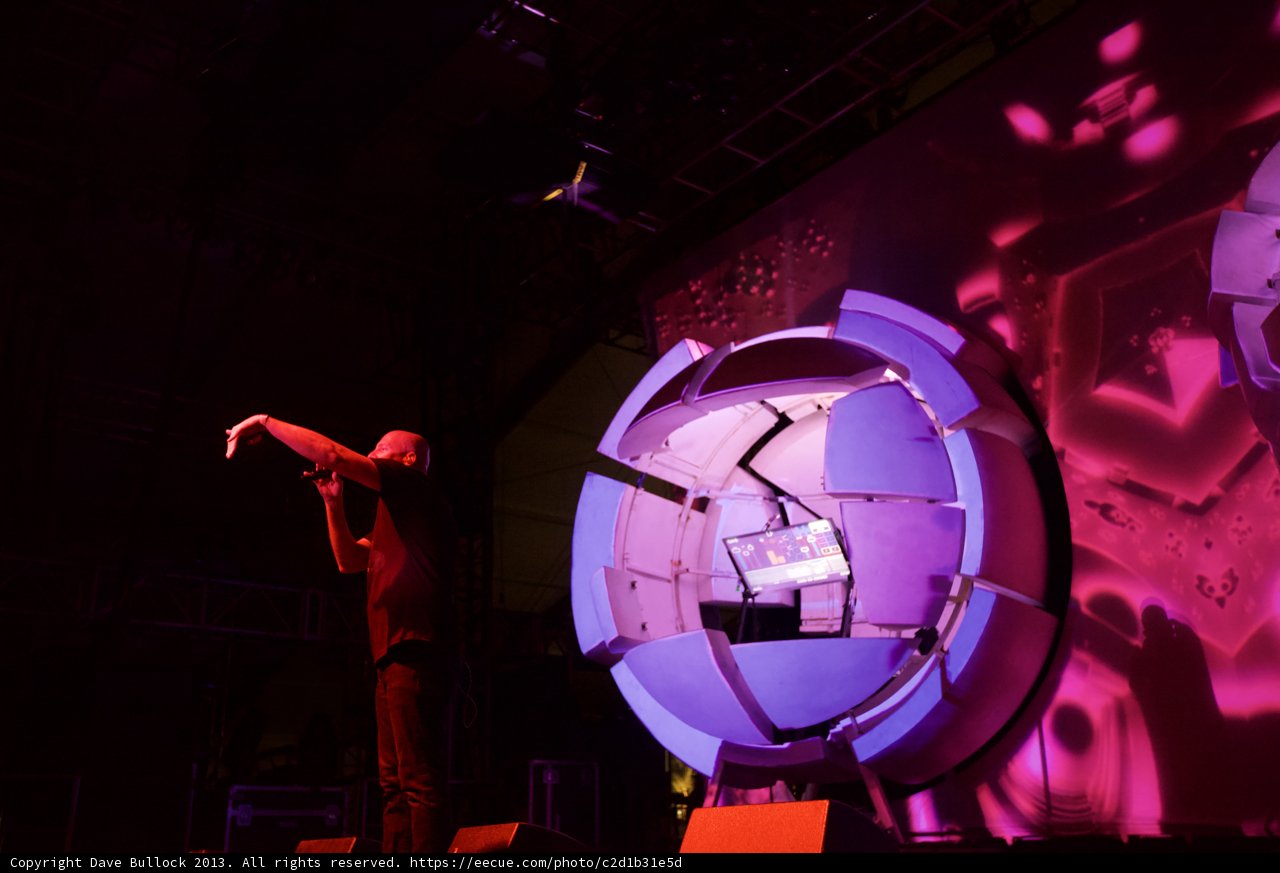 Man on Stage with Futuristic Purple Screen