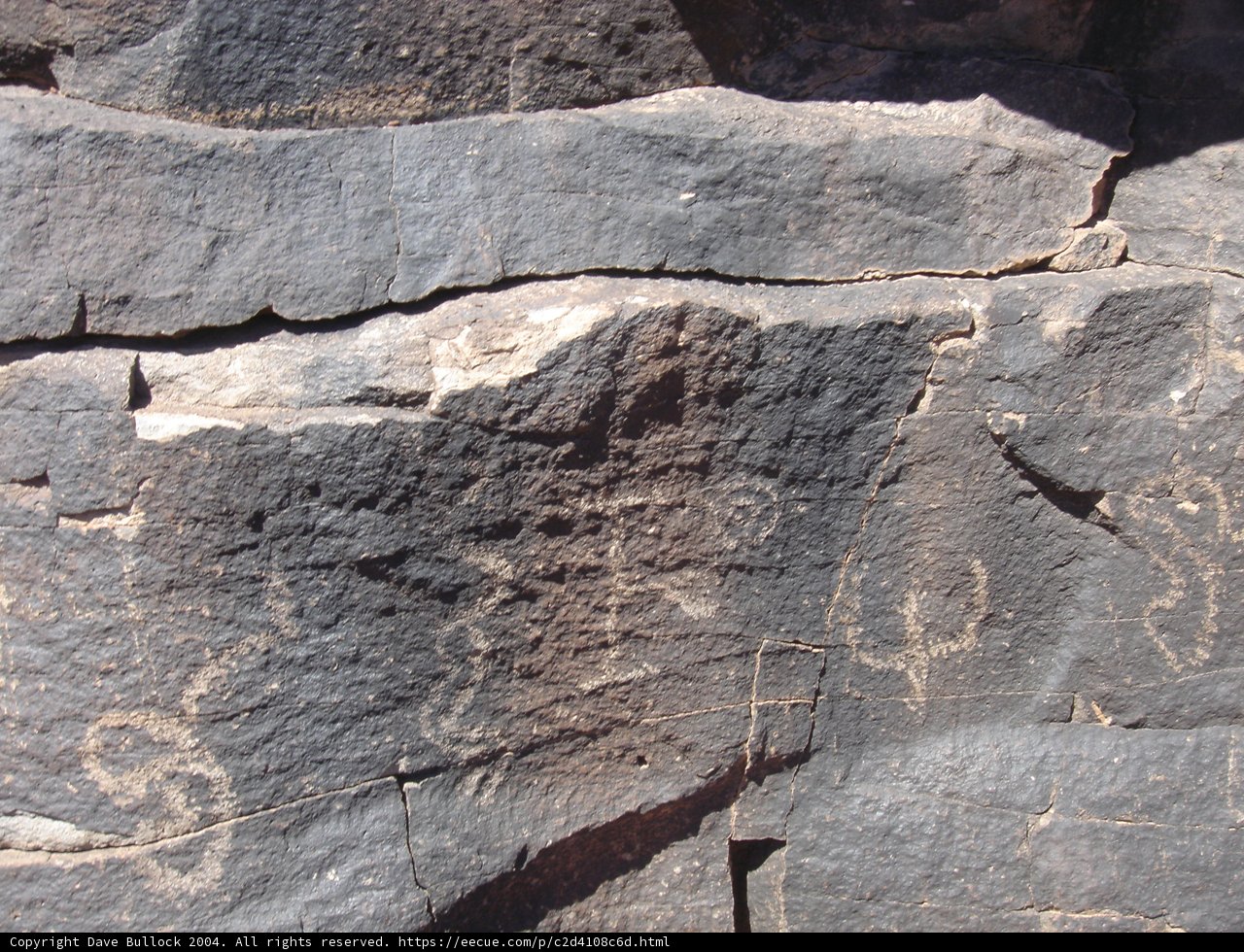 Ancient Petroglyphs on Slate Rock Wall