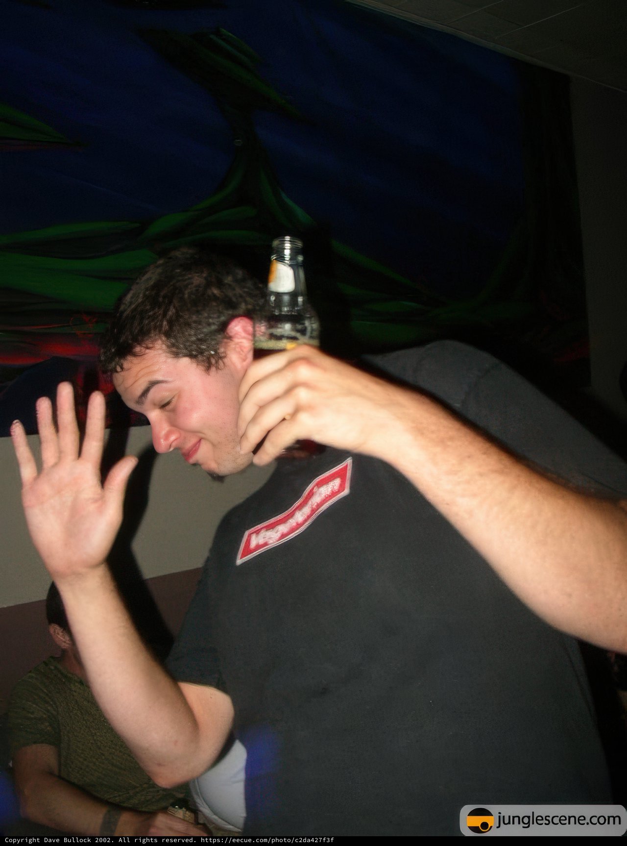 Man Enjoying a Bottle of Beer