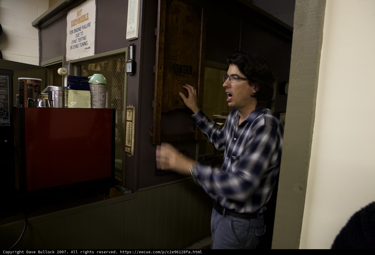 Blue-Shirted Man at the Electronics Store