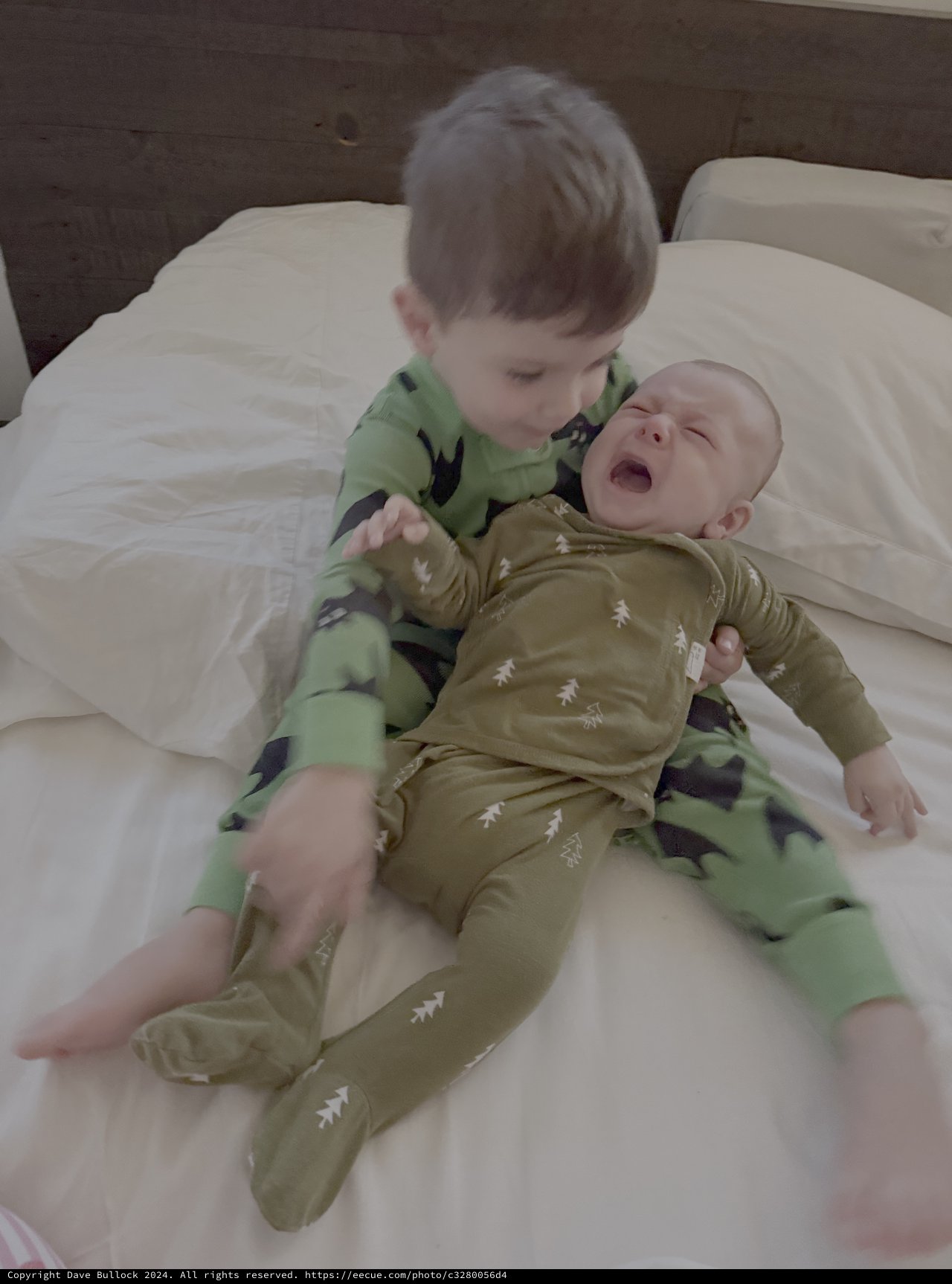 Big Brother Comforting Crying Baby Sibling