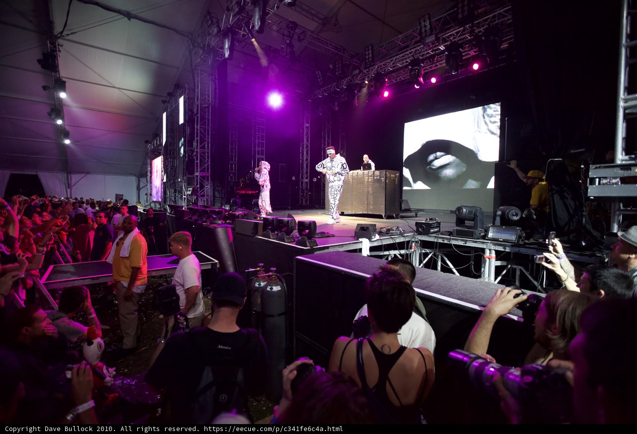 Crowd Cheers on Concert Performers under Spotlight
