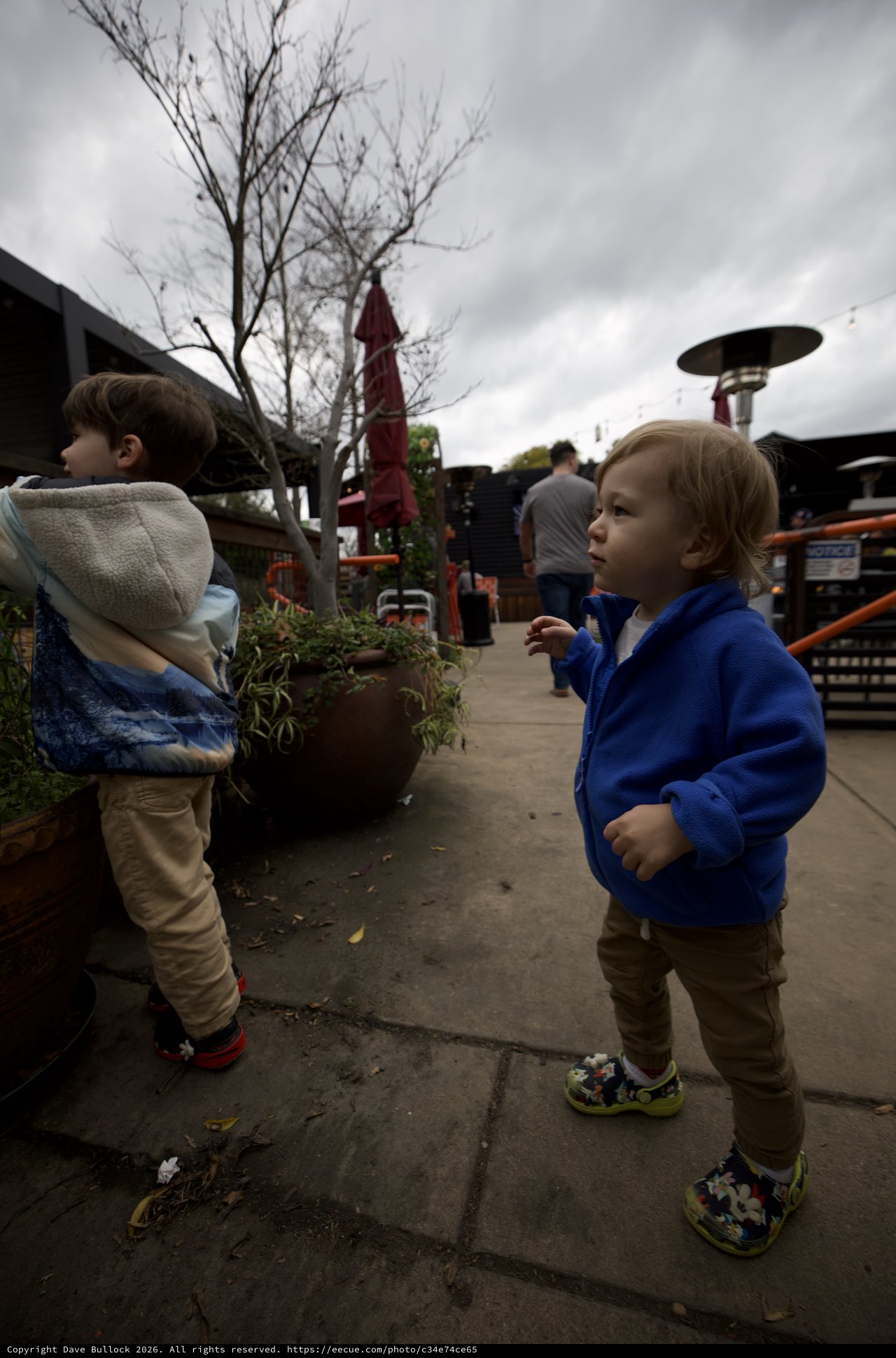 Young Children Exploring a Garden Center on Cloudy Day