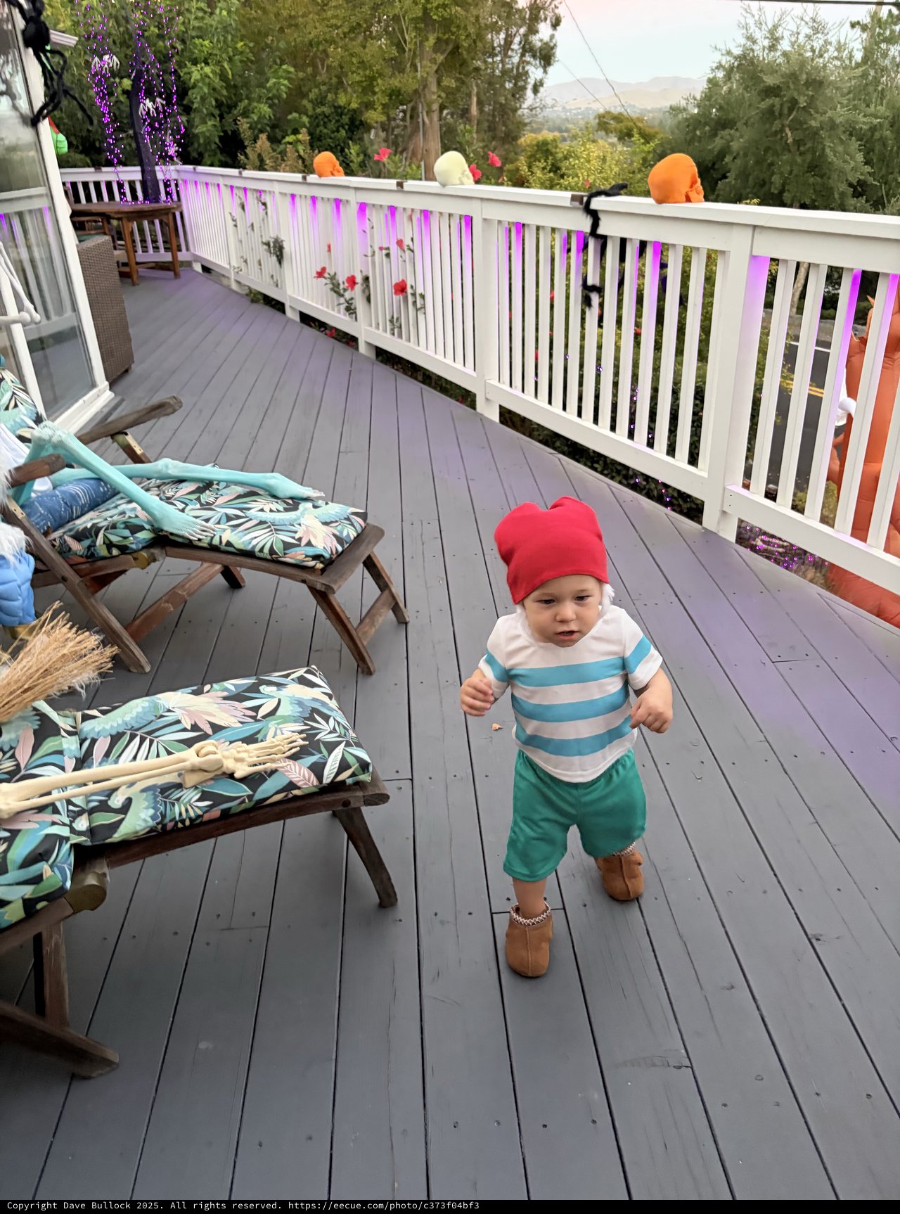 Toddler Exploring Decorated Deck During Outdoor Party