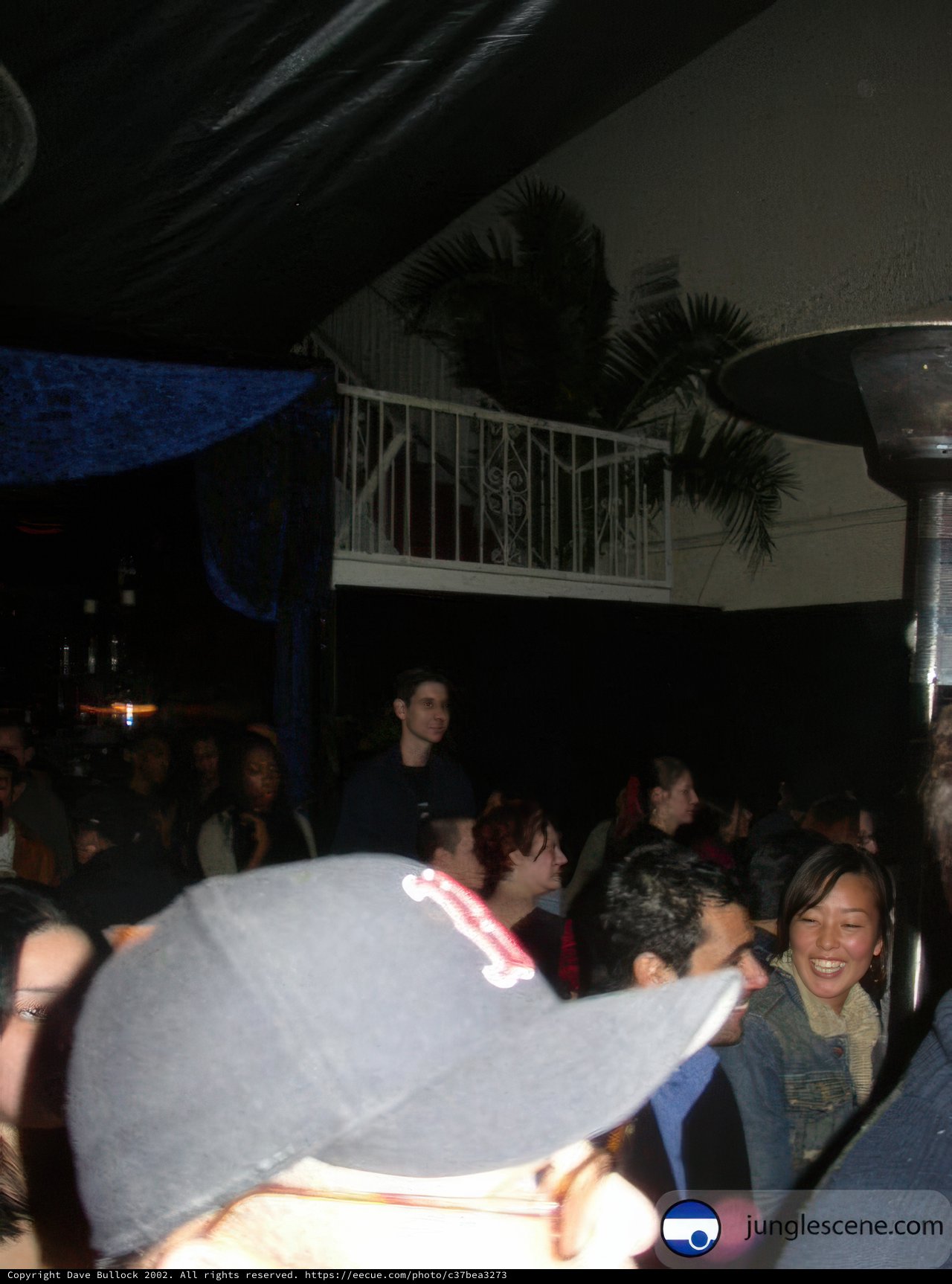 Night Club Gathering with a Man in a Hat