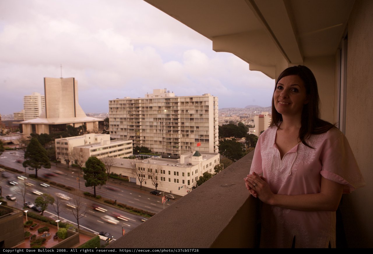 Woman Gazes Over San Francisco City Skyline at Dusk