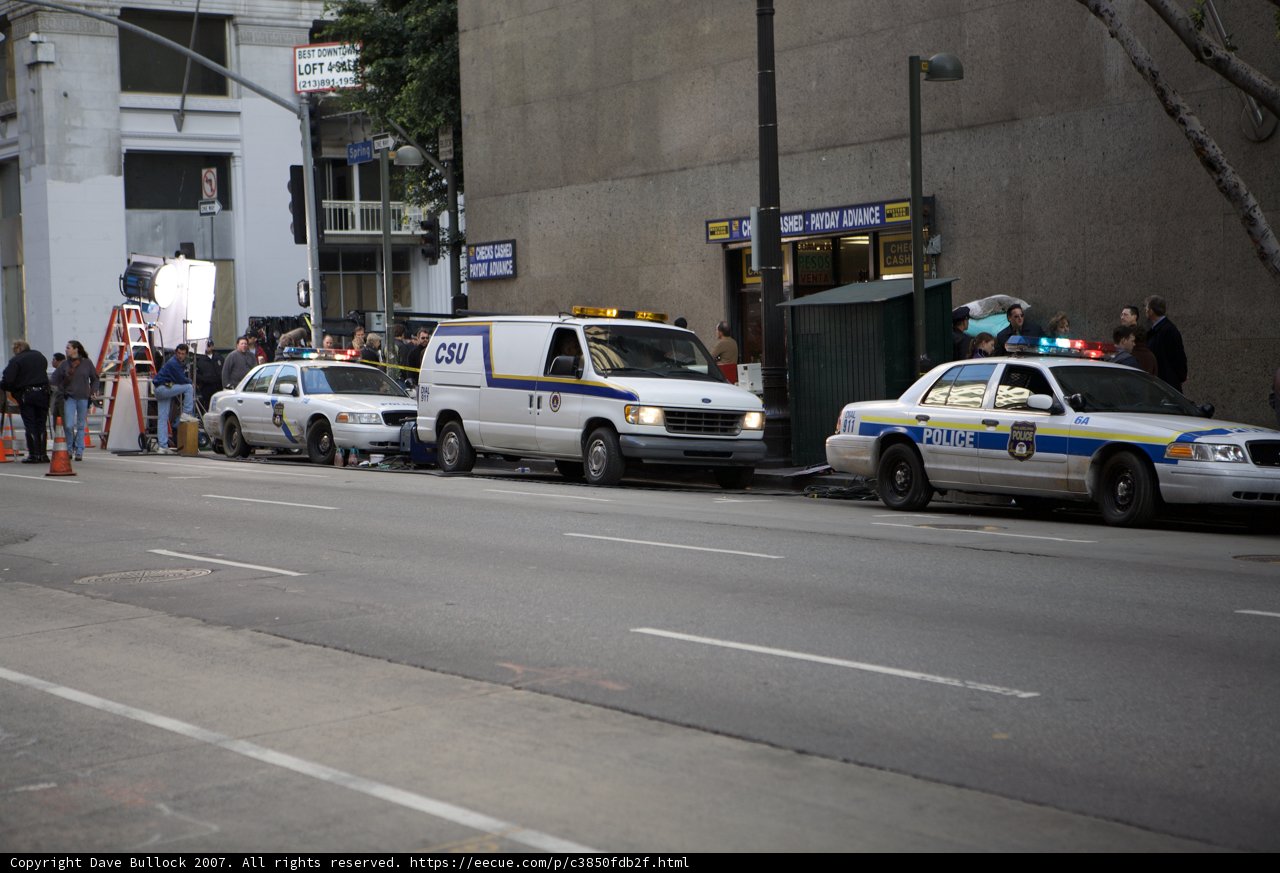 Parked Police Car on the Busy Street