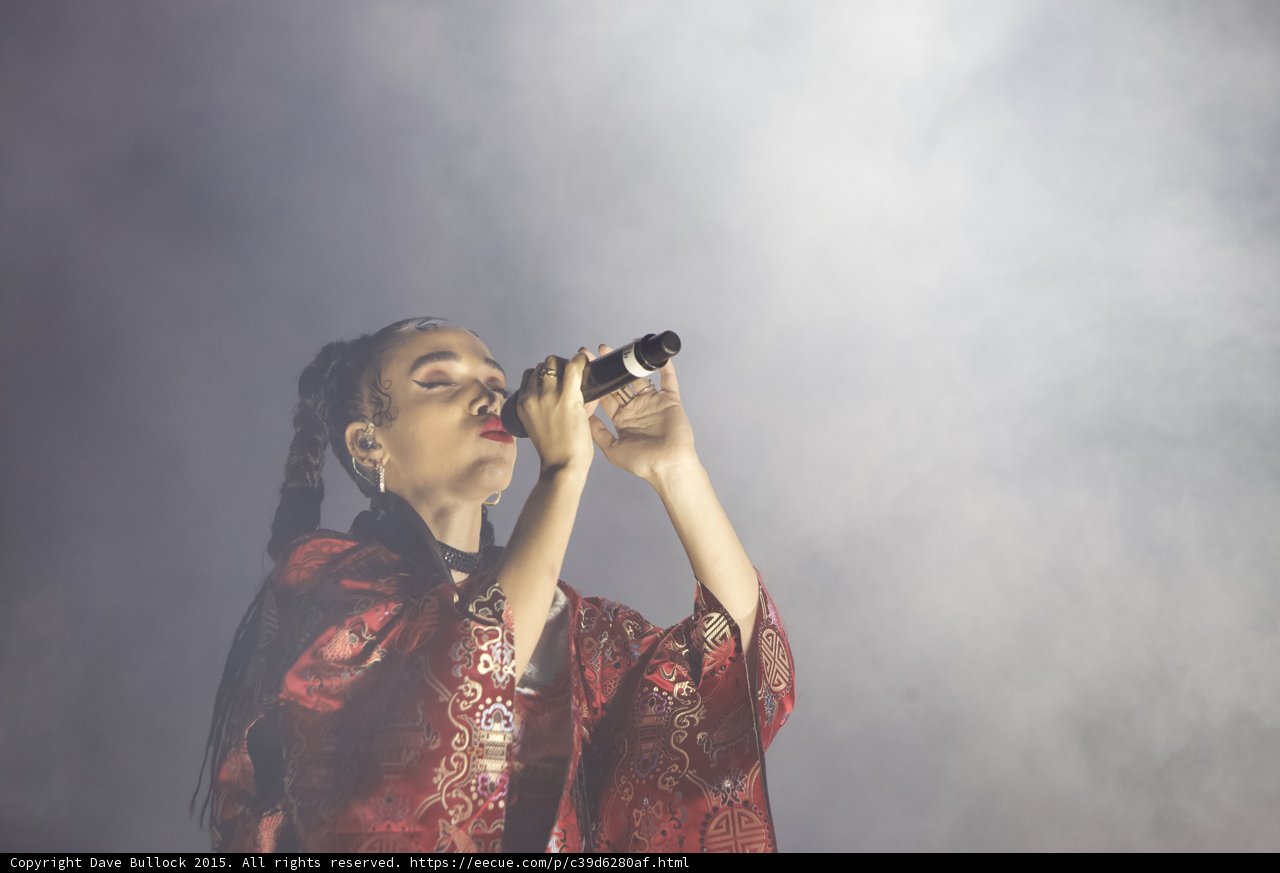 FKA twigs Stunning Portrait Baby Hairs Eyes Closed Red Lipstick Braided Ponytails Hoop Earrings Black Choker Red Brocade Kimono Rings Microphone