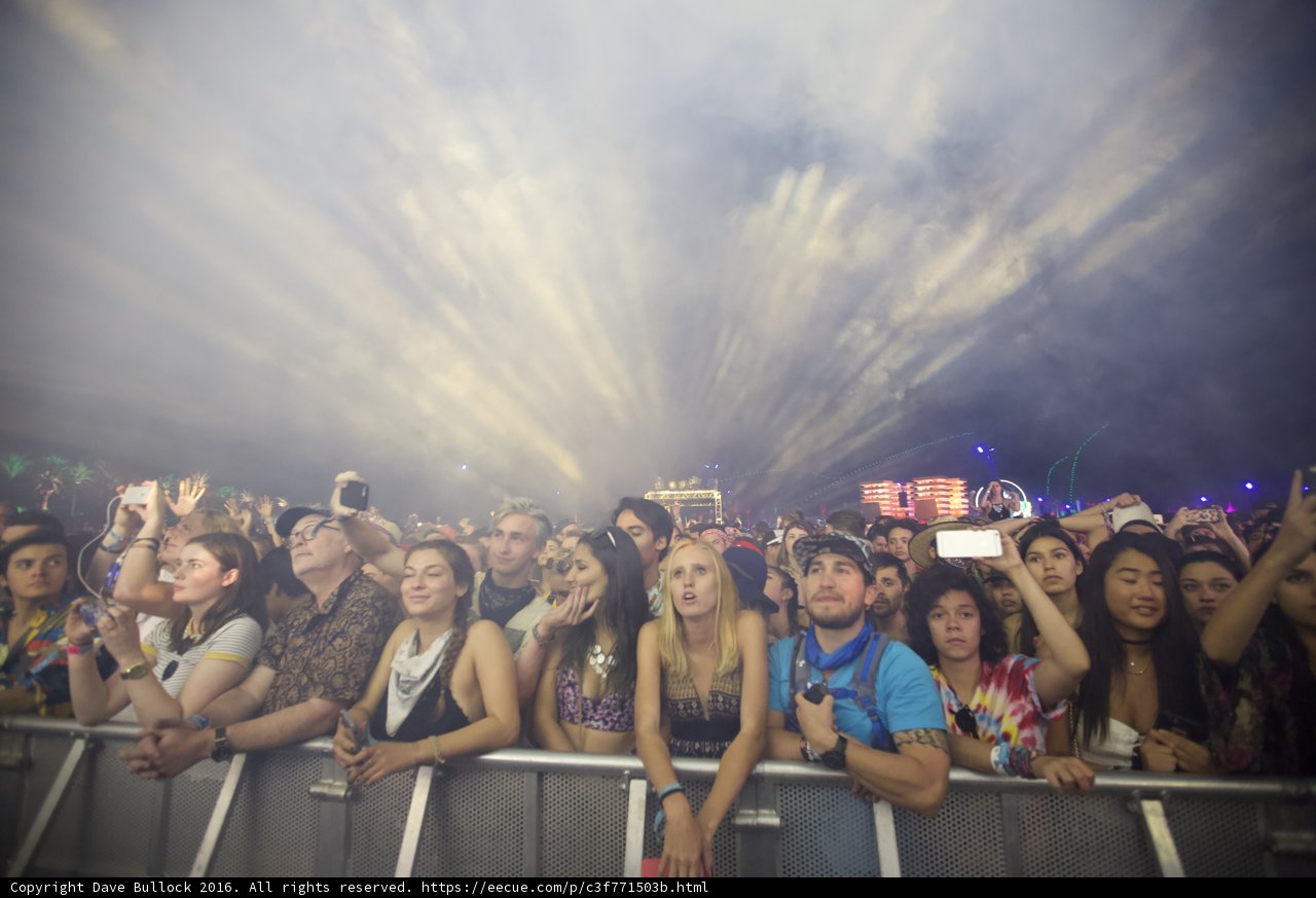 Smoke-filled concert with a lively crowd