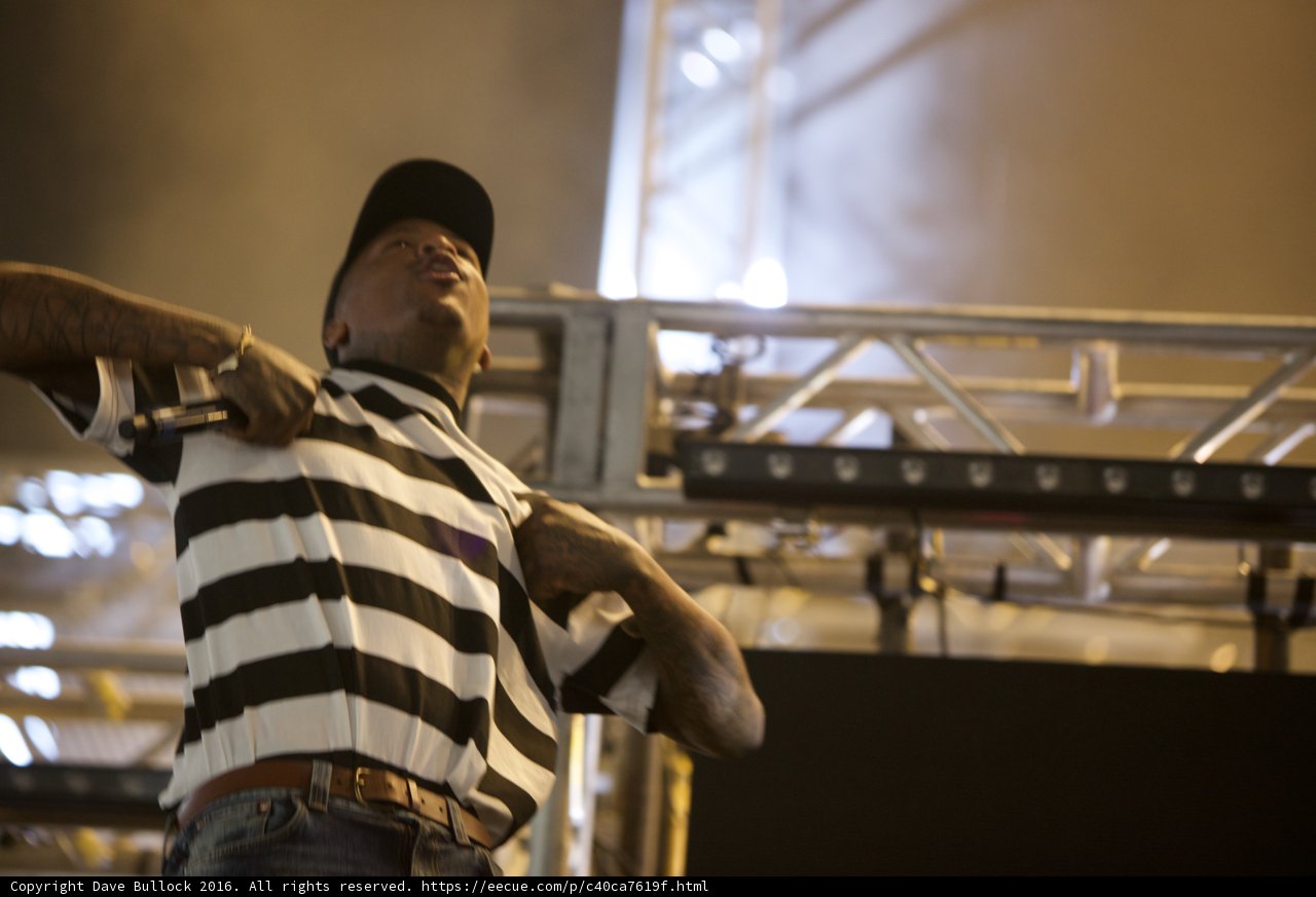 Striped Shirt and Black & White Hat on Stage