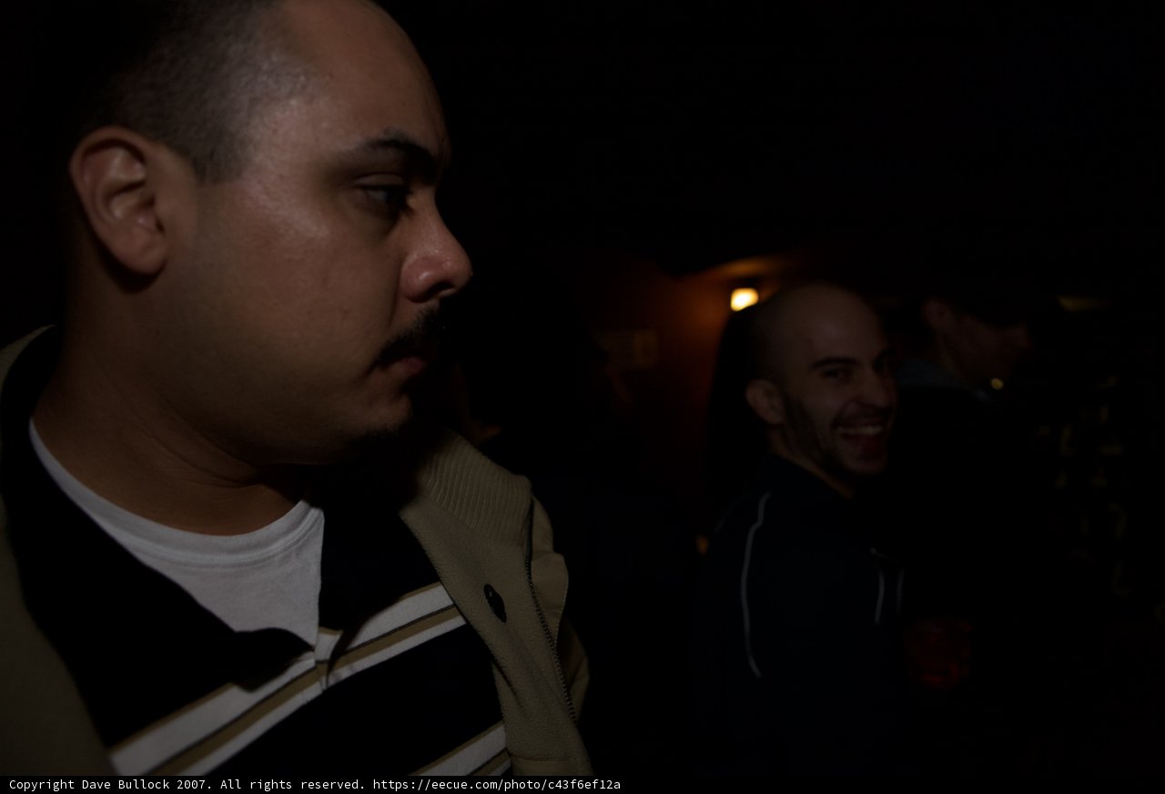 Two Men in a Dark Room