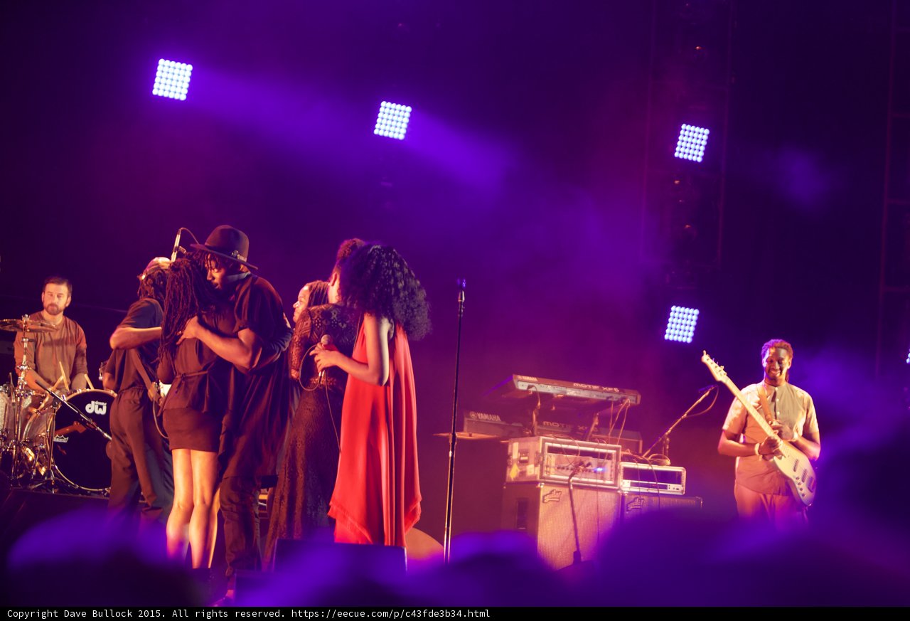 Solange Band Embrace Red Dress Bassist Smiling DW Drums LED Panels Purple