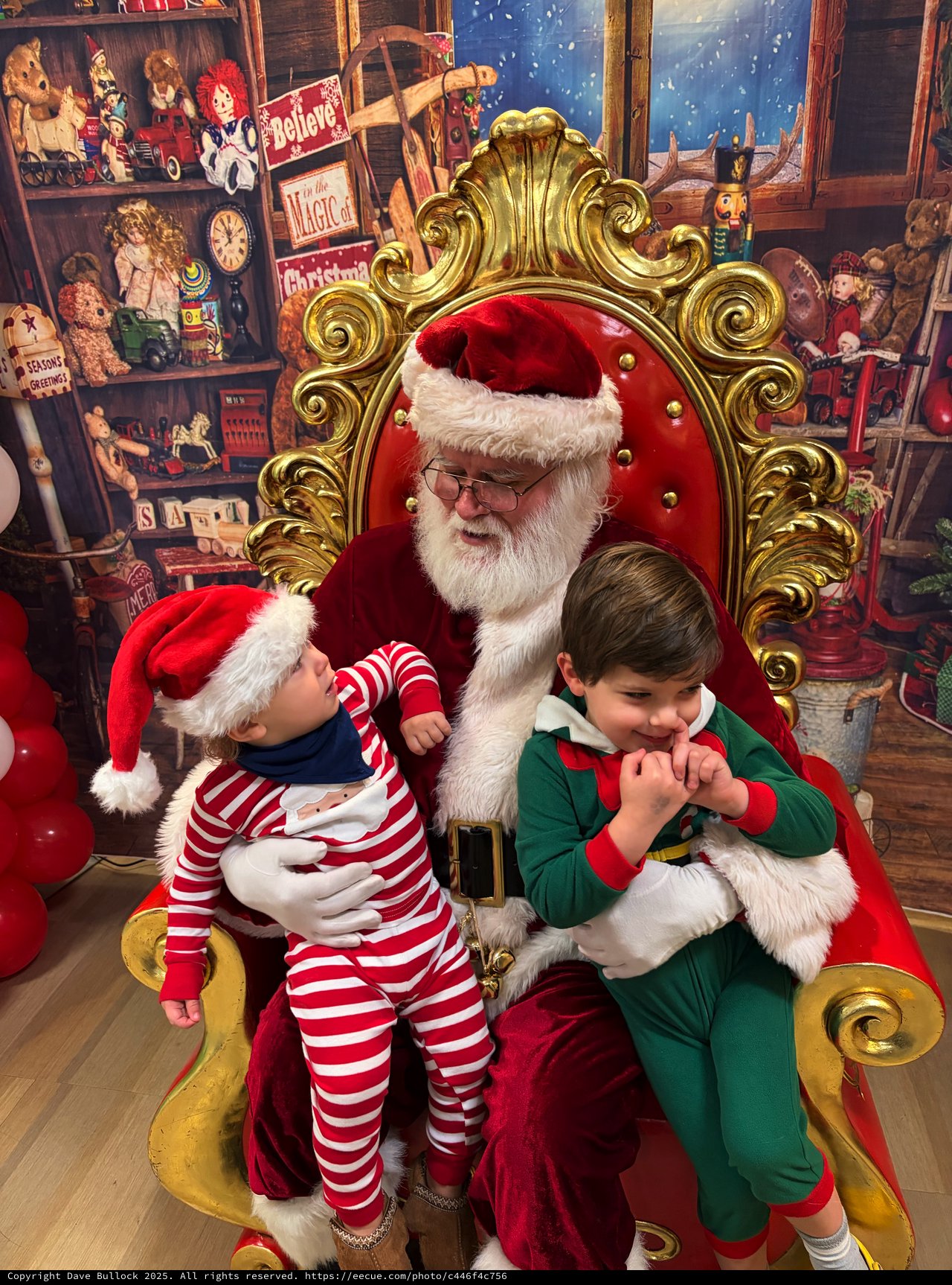 Two Children Visit Santa Claus in His Workshop
