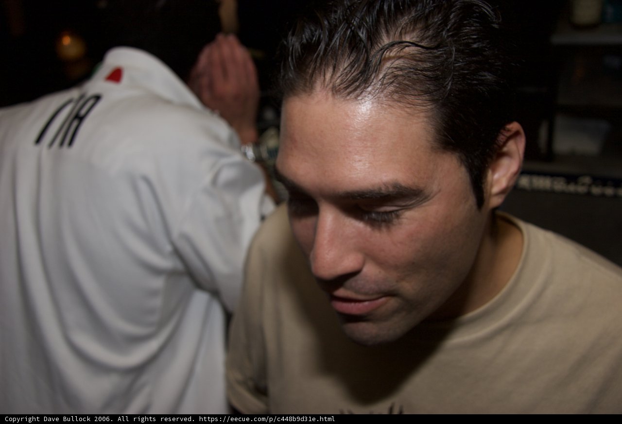 Black Haired Man in White Shirt