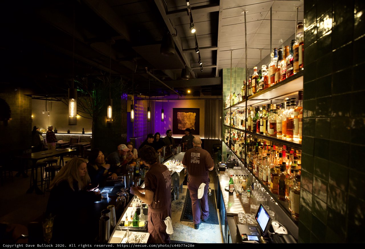 Upscale Cocktail Bar with Illuminated Bottle Display