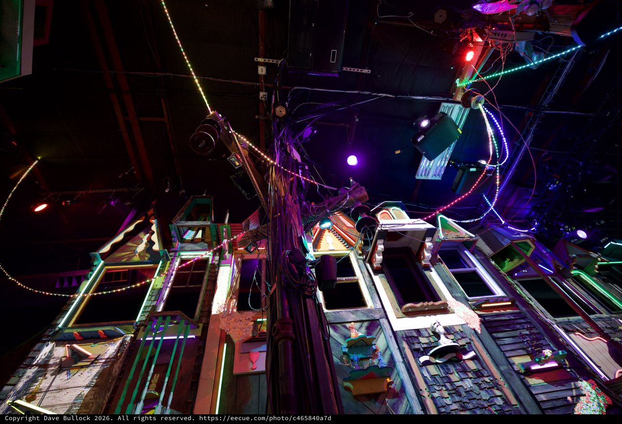 Neon-Lit Chaotic Installation with Vintage Frames and LED Lights