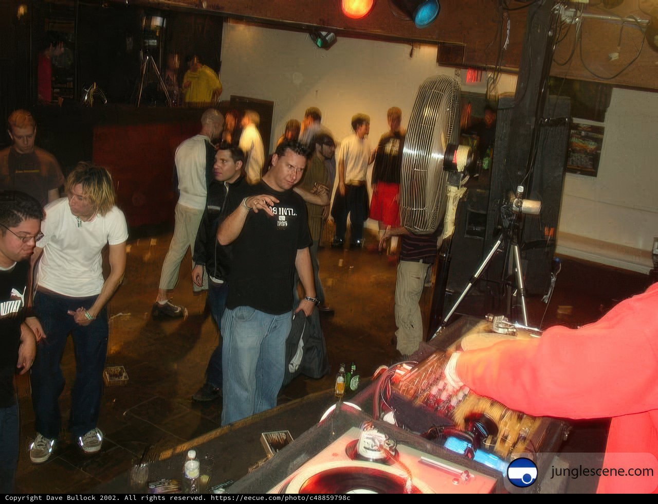 Red Shirt DJ at Night Club