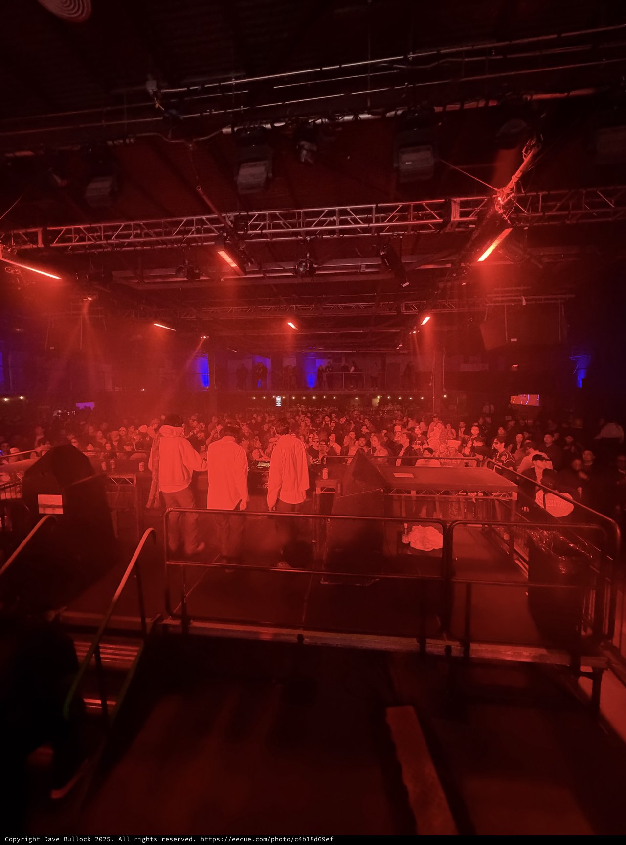 Red-Lit Electronic Music Venue Before Performance