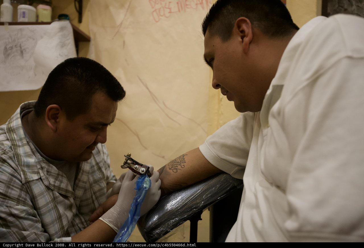 Inking Up: A Tattoo Session with Two Men